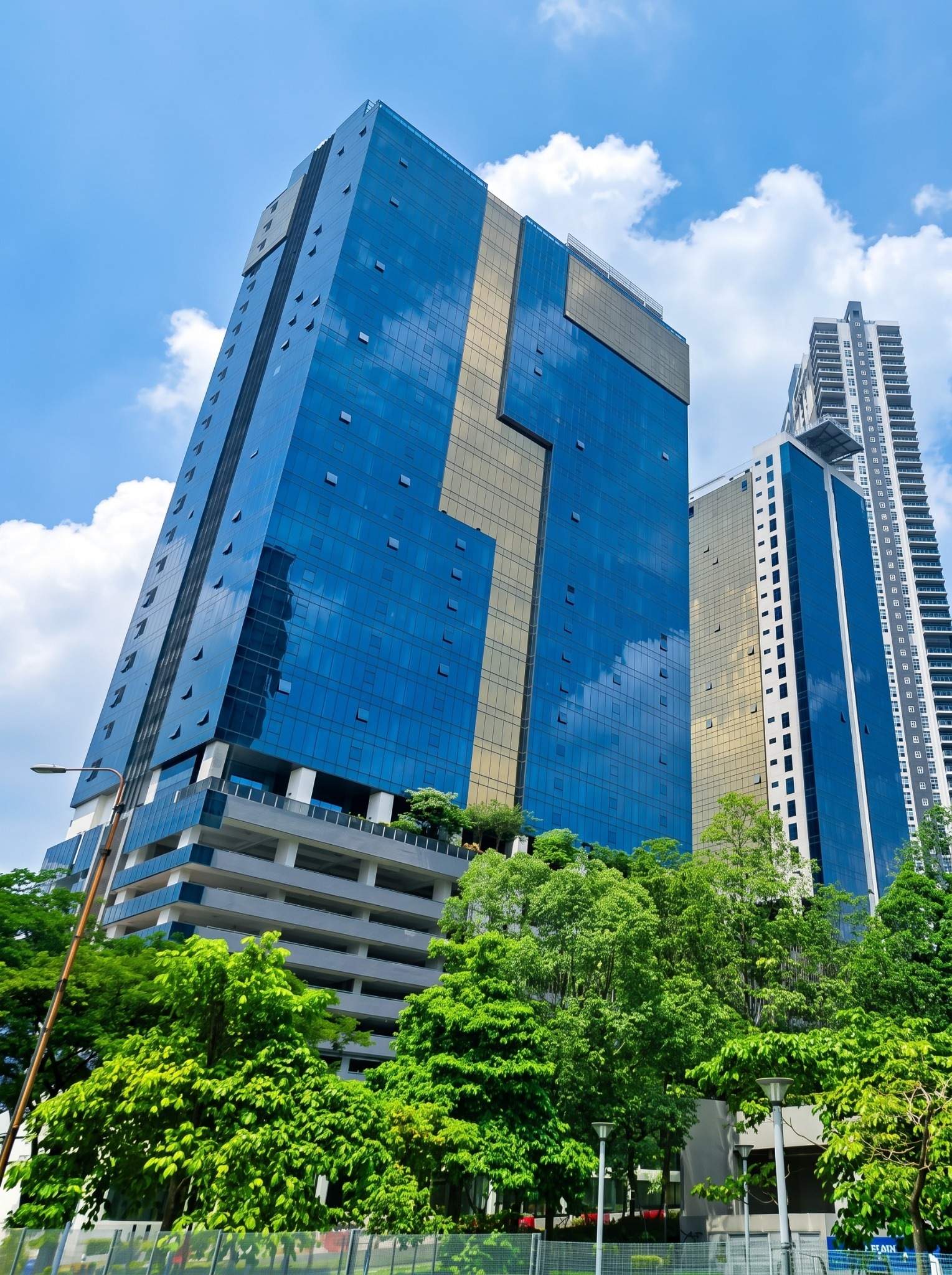 Blue glazed elevation of KL Metropolis MET 1